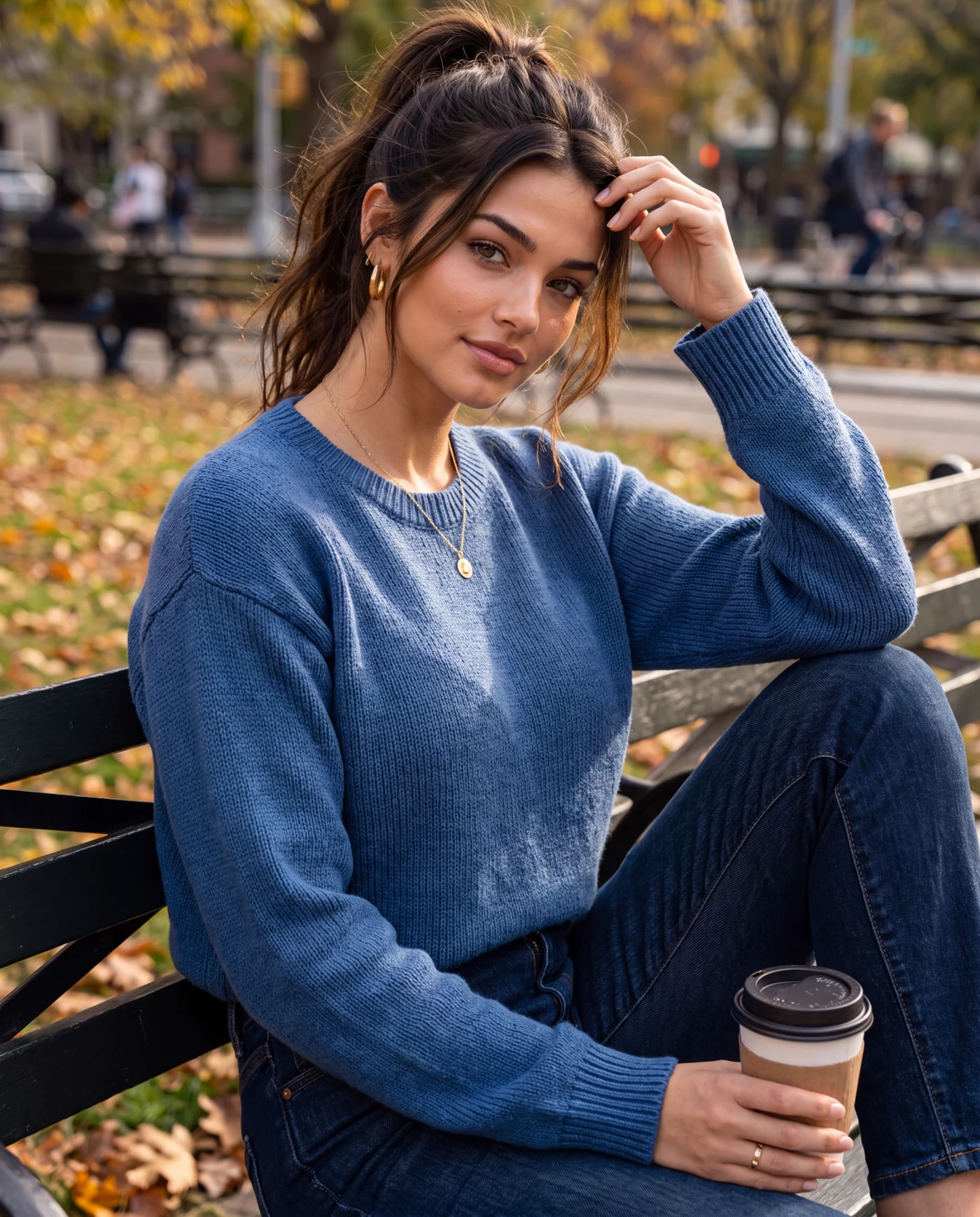 Maya Suri in a relaxed blue knit look outdoors